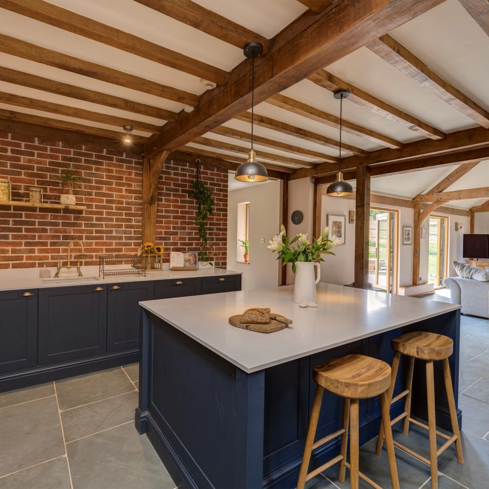 blue shaker kitchen with white work top island